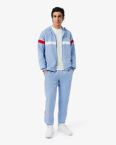 LACOSTE Tuta Con Banda Colorata In Microfibra Azzurra