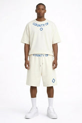 COUNTY OF MILAN Marcelo Burlon Completino Con Stampa Logo Su T-Shirt E pantaloncino Beige/Blu