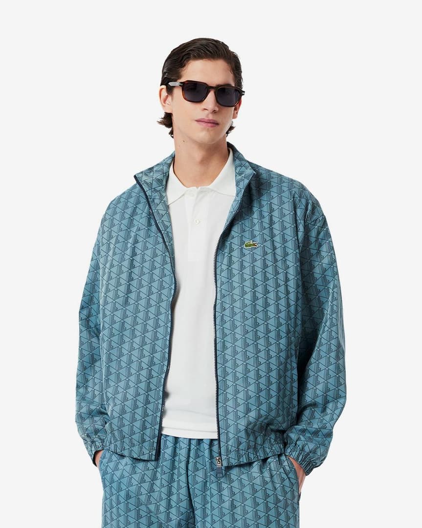 LACOSTE Tuta Monogram In Microfibra Con Zip Azzurra