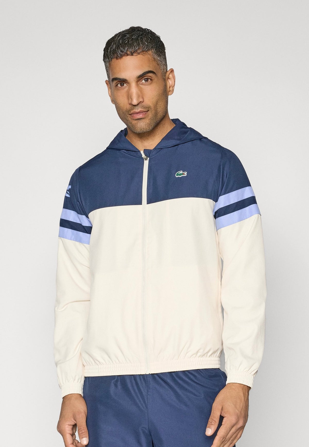 LACOSTE Tuta Leggera In Microfibra Con Zip e Logo Laterale Bianca/Blu/Celeste